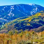Autumn landscape with mountains and hills, showcasing Montrose, Colorado's beauty for Renfrow Realty's properties.