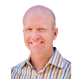 Friendly man in a striped shirt representing Rocky Mountain Commercial Real Estate on a white background.