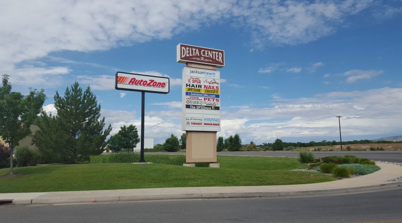 Delta Center retail signage with AutoZone and various business listings, located in Delta, CO, showcasing available commercial space near Valley View Plaza.
