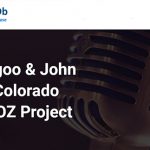 Yoo and John discussing Glenwood Springs real estate trends with microphone for Rocky Mountain Commercial Real Estate update.