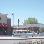 Chick-fil-A restaurant and parking lot near residential buildings in Colorado.