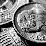 Close-up of U.S. coins showing details, relevant for Rocky Mountain Commercial Real Estate market updates and transactions.