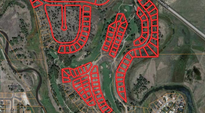 Aerial map of 129 platted single-family lots on Cattails Golf Course, Alamosa, Colorado, highlighting potential development area with outlined lots and surrounding natural features.