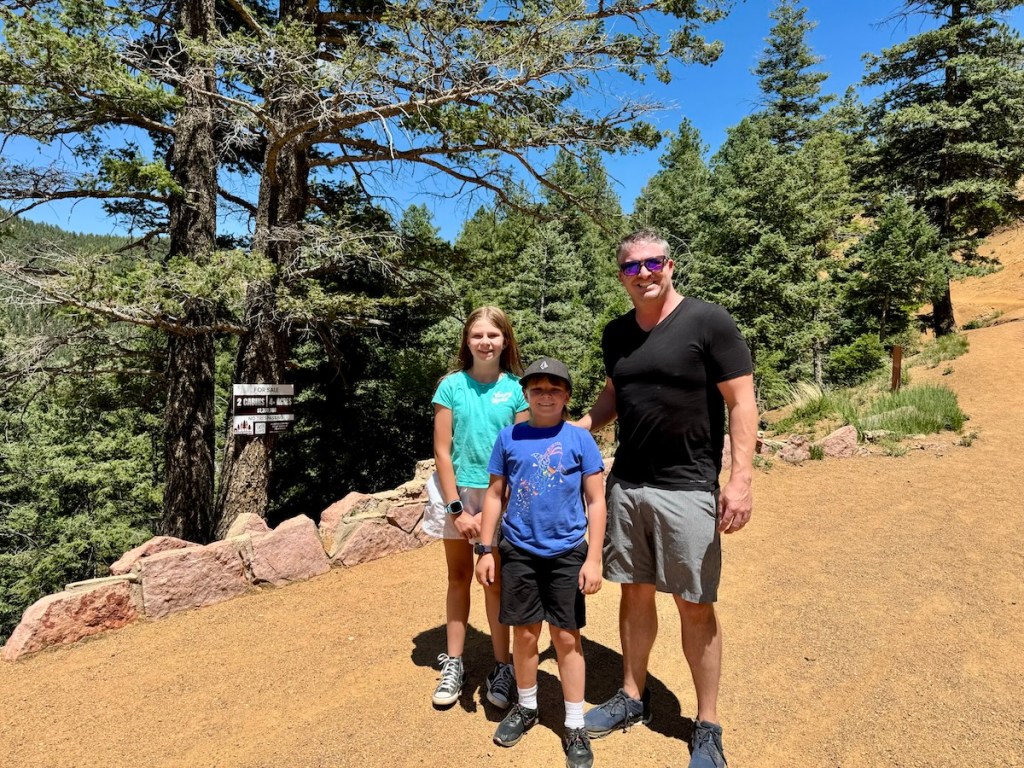 David Porter with children outdoors, surrounded by trees, enjoying family time in nature, reflecting his active lifestyle and personal interests.