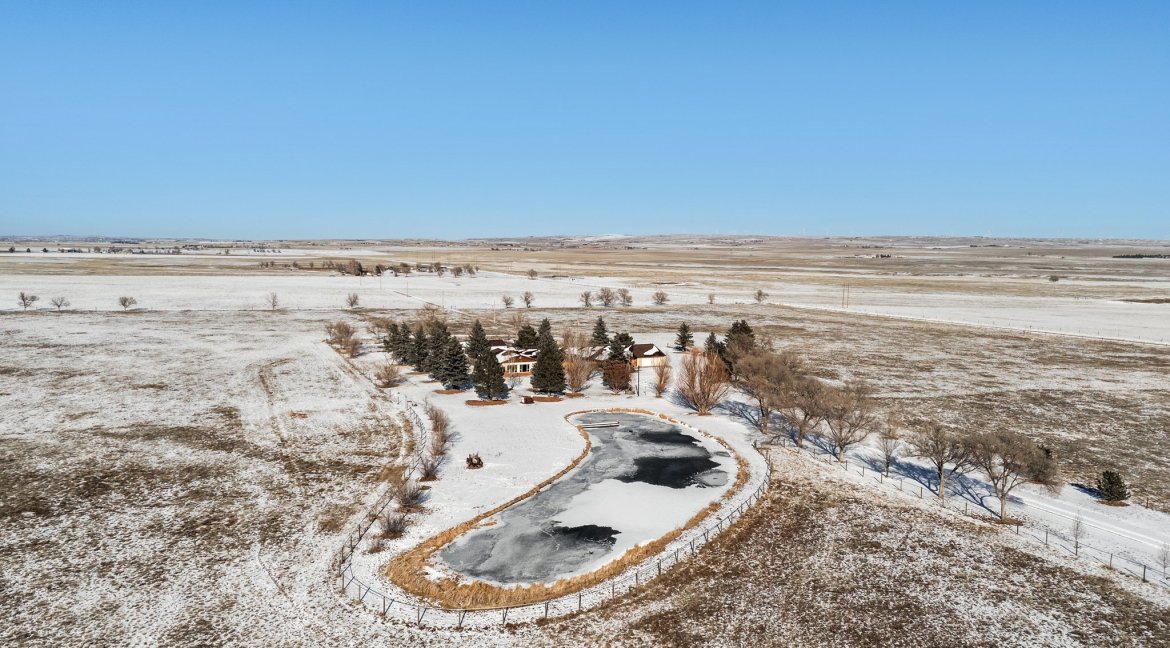 JEB Ranch main residence aerial with pond
