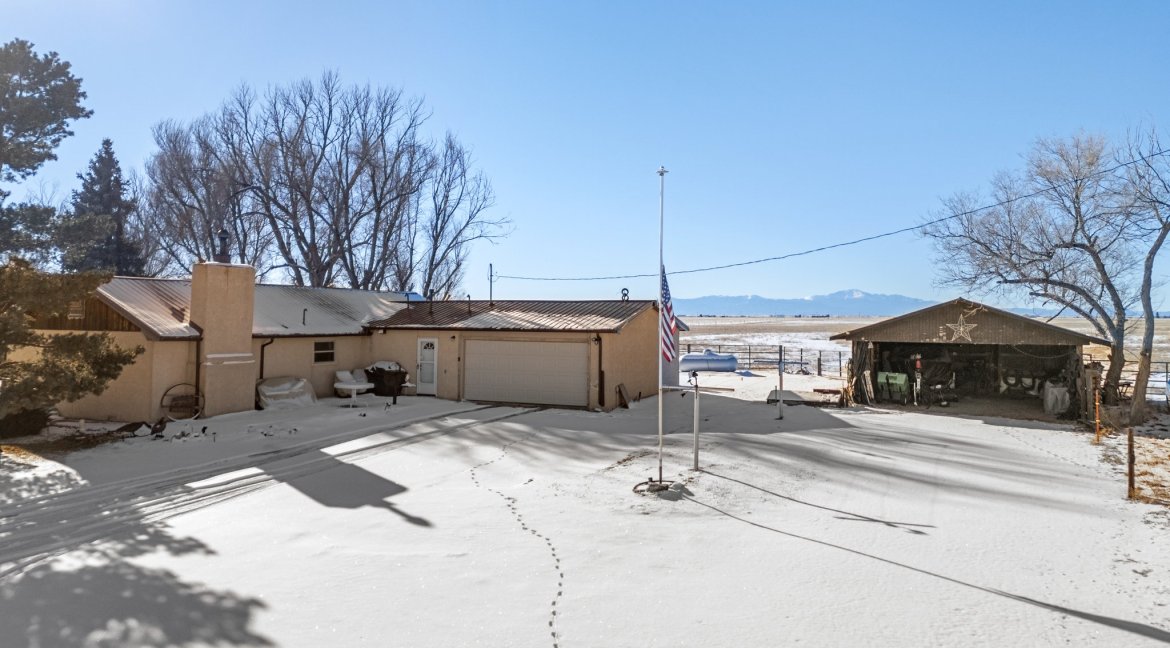 JEB Ranch main residence back view with additional garage