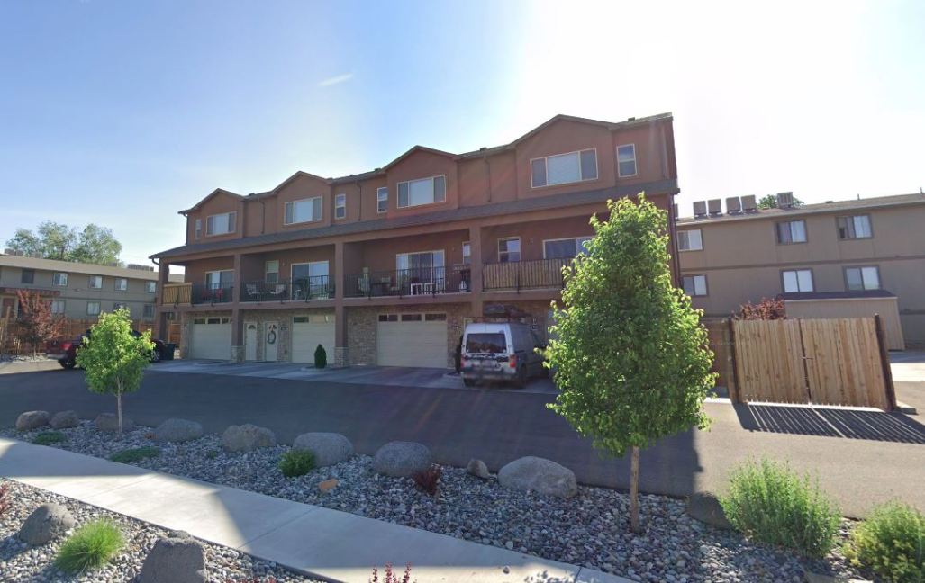 Modern townhome units at 1534 Poplar Drive, Grand Junction, featuring balconies, garages, and landscaped surroundings, ideal for rental investment.