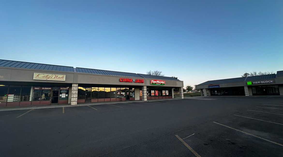 Retail storefronts at Coronado Plaza Shopping Center, featuring China Jade and Papa Murphy's, with Kathy's Nails and H&R Block visible, showcasing commercial leasing opportunities in Clifton, Colorado.